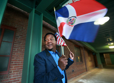 Dominican-born all-star Pedro Martinez proudly waves his home country's flag. Martinez, a three-time Cy Young Award winner and eight-time All-Star pitcher with the Los Angeles Dodgers, Montreal Expos, Boston Red Sox, New York Mets and Philadelphia Phillies, will join Craig Biggio, Randy Johnson and John Smoltz as the four newest players to be inducted to the National Baseball Hall of Fame and Museum July 24-27.