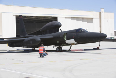 A technician completes final pre-flight checks on a U-2 Dragon Lady before an Open Mission Systems demonstration flight in which fighter aircraft from multiple generations and services exchange penetrating Intelligence, Surveillance, and Reconnaissance, Electronic Warfare and signals intelligence data.