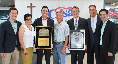 From left to right: Miles Lowenfield, Norma Conrad, Justin Lowenfield, Clay Lowenfield, Ronnie Lowenfield, Greg Wood and Luke Lowenfield. Ms. Conrad and Mr. Wood are Ford Representatives presenting the President's Award and Top 100 Dealers Award to the Lowenfield Family.