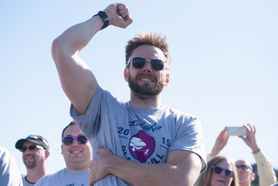 Joel McHale cheers the crowd during the Alaska Airlines Plane Pull with Russell Wilson, benefiting Strong Against Cancer at The Museum of Flight in Seattle on Tuesday, July 28, 2015. Team Wilson pulled the 737 in 16.9 seconds, with Team Joel coming in at over a minute.