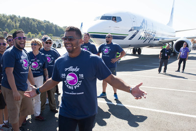 Seattle Seahawks Quarterback Russell Wilson pulls a plane during the Alaska Airlines Plane Pull with Joel McHale benefiting Strong Against Cancer at The Museum of Flight in Seattle on Tuesday, July 28, 2015. Team Wilson pulled the 737 in 16.9 seconds, with Team Joel coming in at over a minute.