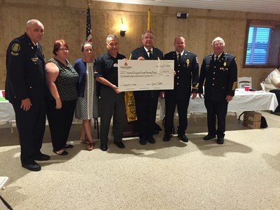 Representatives from Community Bank of the Chesapeake present the donation check to the Southern Maryland Volunteer Firemen's Association.