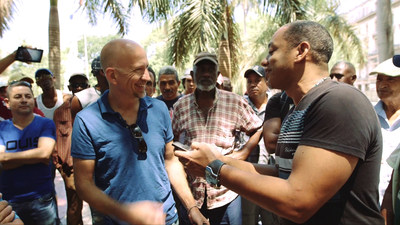 REINVENTING CUBA.  Documentary Host and Correspondent Gerry Hadden (left) meets the people of Cuba in a revealing new documentary about a changing Cuba produced by CCTV America. Cut off from America by decades of hostility, living in conditions of scarcity and political restrictions, the Cubans emerge here as a people making something out of nothing with whatever is at hand.  Hadden portrays vibrant, hopeful, and resourceful characters facing enormous challenges in today's Cuba.