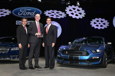 James Verrier, President and Chief Executive Officer, BorgWarner (middle), accepted a 2014 World Excellence Award from Hau Thai-Tang, Group Vice President, Global Purchasing, Ford Motor Company (left), and Mark Fields, President and Chief Executive Officer, Ford Motor Company (right).