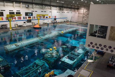 NASA's Neutral Buoyancy Laboratory (NBL) in Houston, Texas. The NBL is the pool NASA uses for astronaut spacewalk training and testing scenarios and new equipment. Raytheon provides maintenance and operations support at the facility.