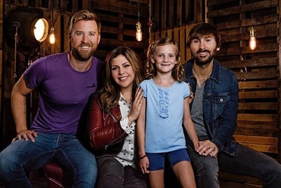 Grammy Award-winning band Lady Antebellum with St. Jude patient, Mae, for Chili's Create-A-Pepper campaign