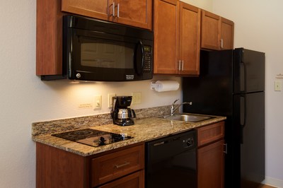 Guests enjoy a full kitchen with all pots, pans and utensils at the 3-time Award Winning Candlewood Suites Fort Worth West.