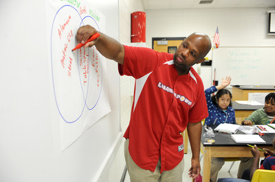 Georgia Power Energy Efficiency Education Coordinator Cedric Sheffield works with students in the classroom during a recent Learning Power summer camp.