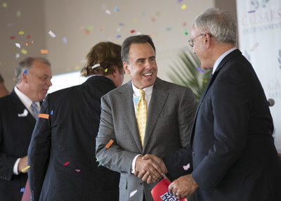 Mark Frissora, Caesars Entertainment President and CEO shakes hands with John F. Palmieri, Executive Director, Casino Reinvestment Development Authority (CRDA) at the grand opening of Harrah's Atlantic City Waterfront Conference Center on Thursday, September 17th