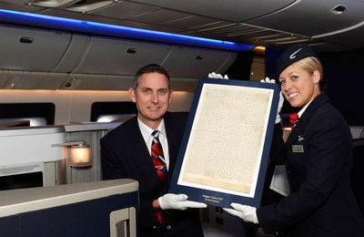 British Airways staffers proudly display an original copy of the Magna Carta, which flew across the Atlantic yesterday on a British Airways flight to New York. The flight marked the start of the Magna Carta's global tour to celebrate its 800th anniversary as one of the most important historical documents in the world. Over the course of four months, this original version of the document from 1217 will pass through seven countries, across four continents and 25 time zones, travelling approximately 65,000 miles.