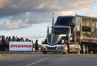 A NASCAR(R) hauler driver makes his way into the infield for the SYLVANIA 300 race weekend at New Hampshire Motor Speedway during the sixth annual Hauler Parade on Sept. 24, 2015. The Hauler Parade is the kick-off to race weekend and brings SYLVANIA Automotive Lighting's 