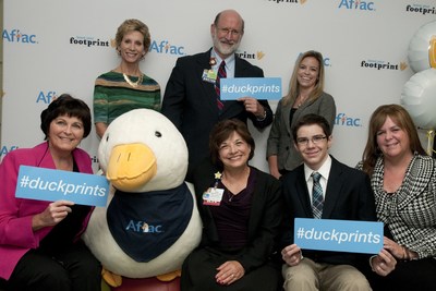 The Aflac Duckprints campaign flew into Dayton Ohio today to honor a family, a civic group and a beloved nurse for their hard work in fighting childhood cancer.Left to right back -- host Cheryl McHenry, Dr. Adam Mezoff, Aflac Associate Susan SavardaLeft to right front -- Honorees Nancy Lehren of the Optimist Club, Nurse Robbie Mirisciotti, and Colin & Maureen Beach