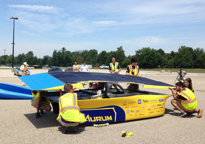 IBM Research today announced that it is providing advanced solar forecasting technology to help the University of Michigan (UM) team power its solar car in the Bridgestone World Solar Challenge, an 1,800-mile (3,000-kilometer) race across the Australian Outback. The UM student team will leverage IBM Research's cognitive computing expertise to gain real-time insights into conditions such as cloud cover and wind patterns as well as determine how much solar power will be available to fuel their car along the course race. As the car is solely powered by solar energy, more accurate forecasts can help the UM students decide how to drive their car more efficiently and improve their chances for winning. Pictured, the University of Michigan team preps their solar car Aurum.