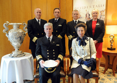 HRH Princess Anne, patron of the National Museum of the Royal Navy (NMRN), takes a photo with Queen Mary 2 Captain Kevin Oprey, front left, and the ship's Hotel Manager Robert Howie, Chief Engineer Brian Harrison, Deputy Captain Stephen J. Howarth and Human Resources Manager Valerie Contreras, back left to right. (Photo by Diane Bondareff/AP Images for Cunard)
