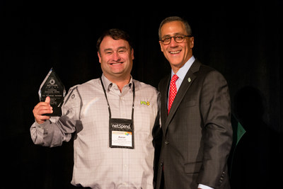(Left - PLS® Financial Services' SVP and Chief Marketing Officer, Aaron Caid receives the 2015 FiSCA® STAR AWARD on behalf of PLS® at the 2015 Financial Services Centers of America Annual Conference in Orlando, Florida.)