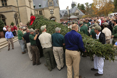 Employees at Biltmore in Asheville, NC, hoist a 35-foot-tall tree for placement in the Biltmore House Banquet Hall. The arrival of the tree signals the start of the estate's annual holiday celebration, Christmas at Biltmore.