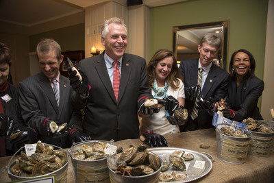 Governor McAuliffe and the First Lady Shucking Oysters
