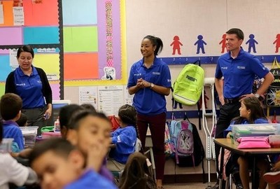 WNBA's Briann January (center) and BBVA Compass Phoenix CEO Brad Parker (right) share the importance of financial education with William T. Machan students during the BBVA Compass Future Builders Program in Phoenix on Nov. 12.