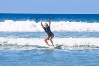Surfer girl catches her 1st wave at our Costa Rica Surf Camp for Women