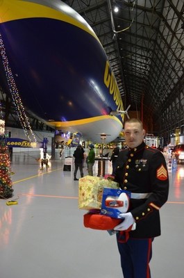U.S. Marine Sgt. Richard Radtke is all smiles during the 2014 Toys for Tots drive at the Goodyear blimp base in Suffield, Ohio. The Goodyear Tire & Rubber Company's three U.S. blimp bases are gearing up for their fifth annual effort to benefit the Toys for Tots Foundation in 2015.