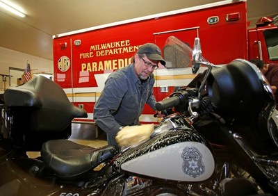 Bill Davidson, vice president of the Harley-Davidson Museum, washes a Milwaukee police motorcycle as other employees wash fire department vehicles in Milwaukee, Wisc. Harley-Davidson announced free Riding Academy motorcycle training to all U.S. first responders from January 1 to December 31, 2016.  (Jeffrey Phelps/AP Images for Harley-Davidson)