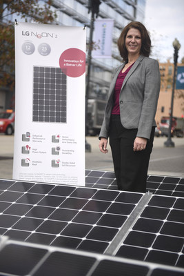 Senior Manager, Sustainability and CSR, Christine Ackerson with LG Solar's flagship LG NeON 2 panels at the Greenbuild International Conference & Expo on Thursday, Nov. 19, 2015 in Washington. LG, one of the Energy Star(R) Partner of the Year 2015, is also a sponsor of the Greenbuild International Conference & Expo. (Kevin Wolf/AP Images for LG Electronics)