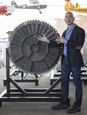 Jeff Bezos showing Apollo 12's F-1 rocket engine injector plate at unveiling ceremony at The Museum of Flight in Seattle. Credit Ted Huetter/The Museum of Flight