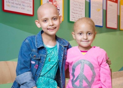 Bustos Media helps raise funds for kids battling cancer like St. Jude patients, Sarah and Camila.