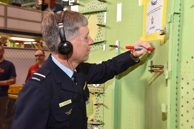 RAAF Air Commodore Adam Brown visited Spirit to see the inline modifications on the first Australian P-8A. During his visit he signed his name on the fuselage of the first Australian P-8A.