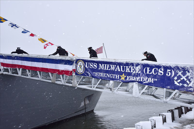 Sailors assigned to the Freedom-variant littoral combat ship USS Milwaukee (LCS 5) man the ship during the commissioning ceremony in snowy Milwaukee, Wisconsin, Nov. 21. Milwaukee will proceed to her homeport in San Diego next year. Photo credit: Lockheed Martin