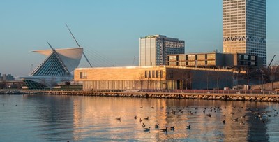 The renovated Milwaukee Art Museum on the shore of Lake Michigan is captured at sunrise.