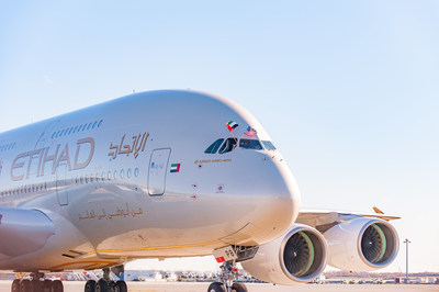 Etihad Airways' A380 pilot waves flags from the United Arab Emirates and United States to celebrate A380 inaugural service between New York's John F. Kennedy International Airport and Abu Dhabi.