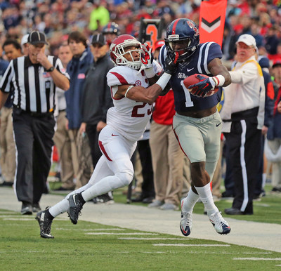 Ole Miss wide receiver Laquon Treadwell eludes an Arkansas defender in a Nov. 7 SEC game at Vaught-Hemingway Stadium in Oxford, Mississippi. Treadwell, a semifinalist for the Biletnikoff Award as the nation's top receiver, and Mississippi State quarterback Dak Prescott, a Heisman Trophy candidate, lead a list of 10 nominees for the 2015 C Spire Conerly Trophy, which annually honors the top college football player in the Magnolia State (photos credit Ole Miss and Mississippi State Athletics)