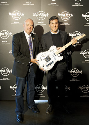 Hard Rock International Chief Executive Officer Hamish Dodds presents custom guitar to Heskel Nathaniel, founder of Trockland Development Group that in collaboration with Hard Rock will develop the future Hard Rock Hotel Berlin Checkpoint Charlie.
