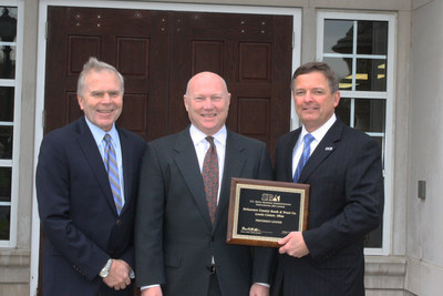 Martin Golden, Columbus District Director of the U.S. Small Business Administration (center) presents Ronald Seiffert, President and CEO of the Delaware County Bank (right) and Mark Shipps, Vice Chair of the Board of Directors of the Delaware County Bank (left), a plaque to commemorate DCB's selection as Preferred Lender status under the SBA's Preferred Lender Program.