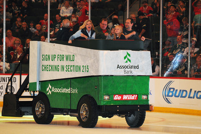 Minnesota Wild fans enjoy a ride on the Associated Bank Ice Cruiser at Xcel Energy Center.