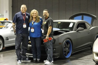 Preparing for the auction of the LINE-X Camaro with proceeds being donated to Operation Mend, from the left - Operation Mend veteran Octavio Sanchez, LINE-X's Director of Marketing Teppy Wigington and LINE-X of Torrance franchisee Herb Grageda.