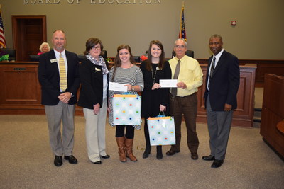 Georgia Power New Teacher Assistance Grant recipients, Brooke Byrd and Erin Wedereit, accepts their grants during a presentation at the Columbia County Board of Education meeting.
