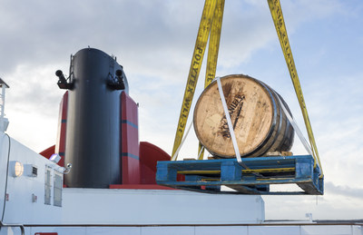 A 300 litre Jack Daniel's barrel being hoisted by crane onto Queen Mary 2 in Southampton, England on Sunday, Jan. 10, 2016.