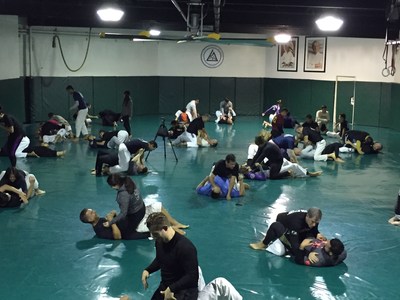 More than 70 wounded veterans and guests perform mixed martial arts moves at the Gracie Academy in Torrance California