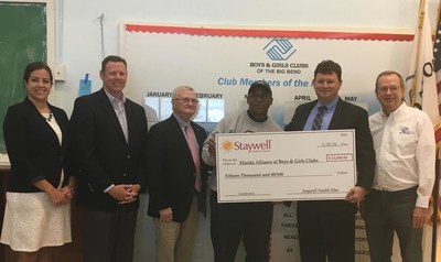 WellCare of Florida Gives $15,000 to Florida Alliance of Boys and Girls Clubs. From left to right: Megan Fox, WellCare's community relations manager; Craig Hansen, WellCare's senior director of government affairs; Daniel Lyons, state director of Florida Alliance of Boys & Girls Club; Lee Wagner, CEO of The Boys & Girls Clubs of the Big Bend; Mike Freeman, WellCare's director of Medicaid marketing; and Jim Clark, president and CEO of Boys & Girls Club of America.