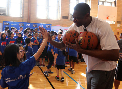 Dikembe Mutombo pictured at a 2015 NBA FIT clinic in New York City (Credit: NBA)