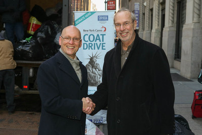 New York Cares executive director Gary Bagley thanks Greater New York Automobile Dealers Association president Mark Schienberg for organizing the collection of 6,000 coats from NYC area franchised automobile dealers.