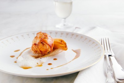 Two of the main dishes on the SHARE by Curtis Stone menu include Twice Cooked Duck with fennel, bacon jus and parmesan crust and Butter Poached Lobster with Caramelized Endive.