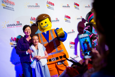 Eight-year-old actress Aubrey Anderson-Emmons, star of ABC TV's "Modern Family," and her mother, comedian, actor and writer Amy Anderson, pose with Emmet, star of "The LEGO(R) Movie(TM) 4D A New Adventure," Jan. 28 at LEGOLAND(R) Florida Resort in Winter Haven, Fla. Celebrities, media and VIPs turned out at the theme park built for kids during a red carpet gala celebrating the world premiere of the brand-new attraction, which combines 3D computer animation, "4D" effects such as wind, water and fog, and the same sly humor that made the movie a worldwide blockbuster.