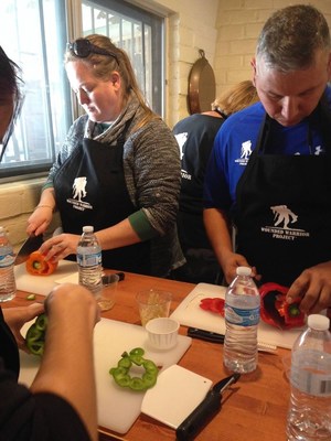 Wounded veterans learn cooking techniques during 3-day health and wellness gathering.