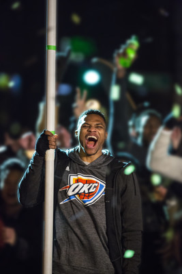 NBA star Russell Westbrook holds the "DEWxNBA" flag during the filming of the final scene of "Make An Introduction," a Mountain Dew television spot airing in the U.S. and Canadaduring NBA All-Star 2016 featuring DEW(R) athletes and 2016 NBA All-Stars Russell Westbrook and Jimmy Butler, and rising star Julius Randle. The shoot was held in Dallas, TX on Jan. 21, 2016. (Shannon Faulk/AP Images for Mountain Dew)