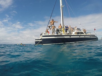 Wounded veterans and their families enjoy time on a catamaran off Kapolei, Hawaii