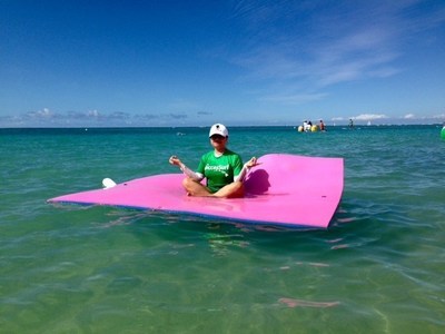 A Wounded Warrior Project Alumna meditates in the surf in Hale Koa.