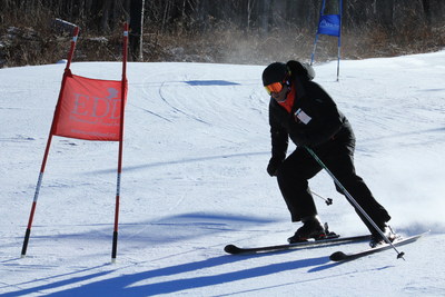 Wounded Warrior Project (WWP) Alumnus races downhill at Windham ski resort in NY. WWP recently partnered with Adaptive Sports Foundation (ASF) to offer racing lessons and biathlon training for wounded veterans. (Photos provided courtesy of Pam Greene, ASF)